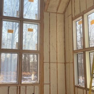Spray foam insulation in exterior walls and ceiling of new construction