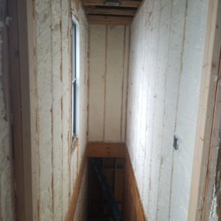 Narrow hallway stairwell wall insulation