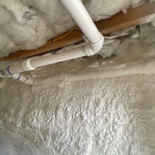 Insulation around water pipes in a crawl space