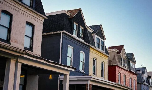 Row of two-story homes in various colors.